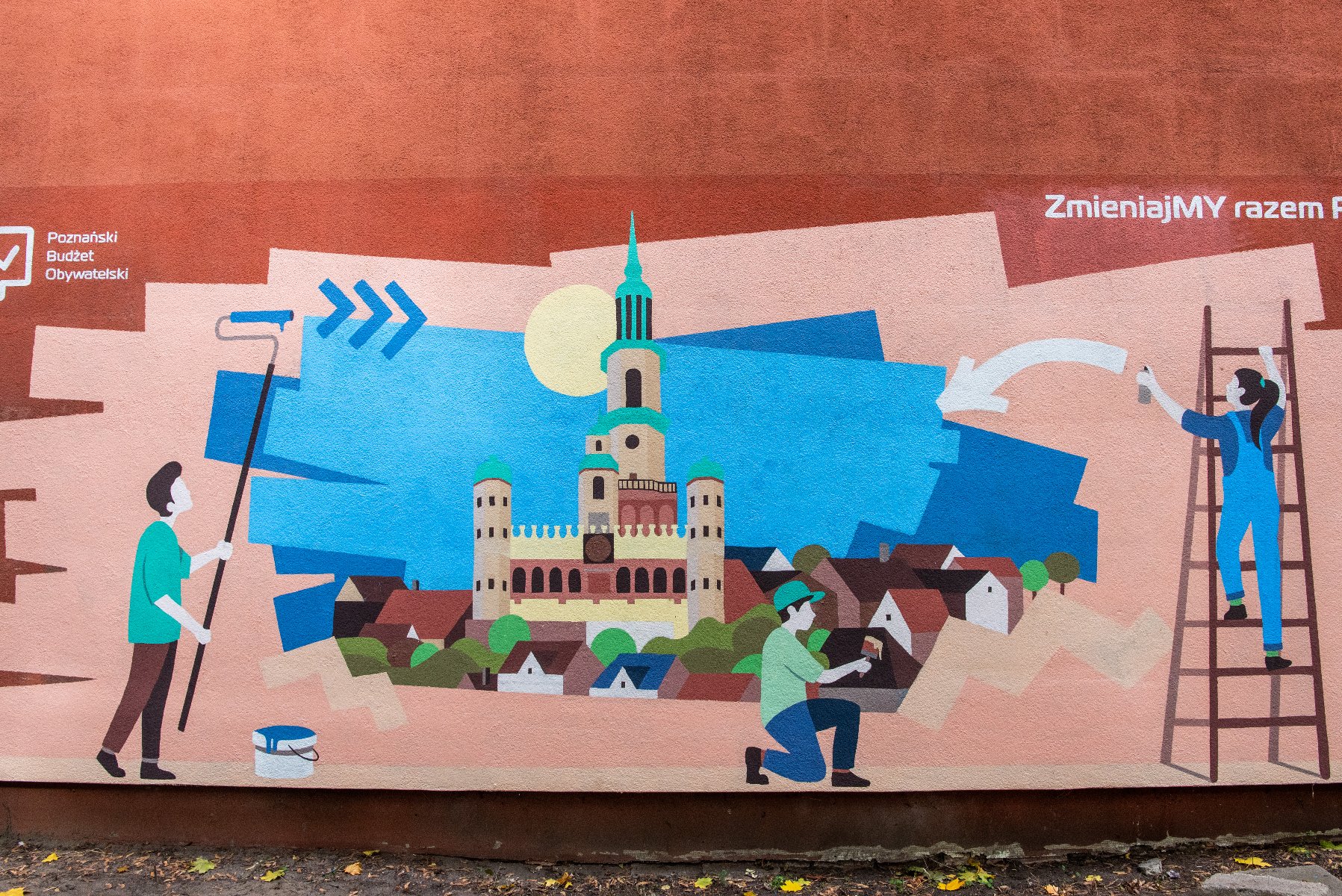 Na zdjęciu mural, przedstawiający dzieci malujące Poznań na ścianie - grafika artykułu