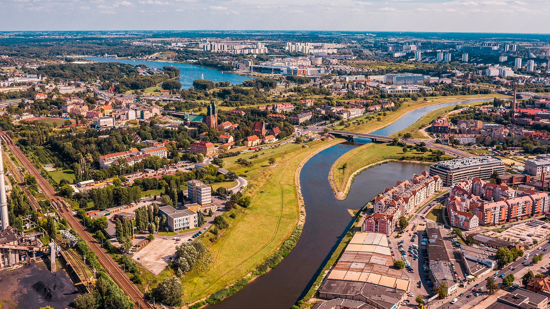 Na zdjęciu panorama Poznania, w centrum zdjęcia widać Wartę - grafika artykułu