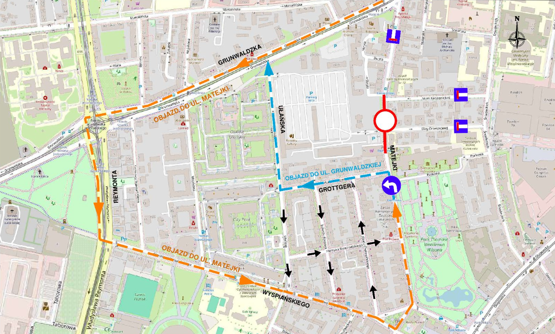 Mapa przedstawia szczegółowy obszar z zaznaczonymi trasami objazdowymi i kierunkami ruchu. Zawiera różne ulice, budynki, parki i punkty orientacyjne. - grafika artykułu