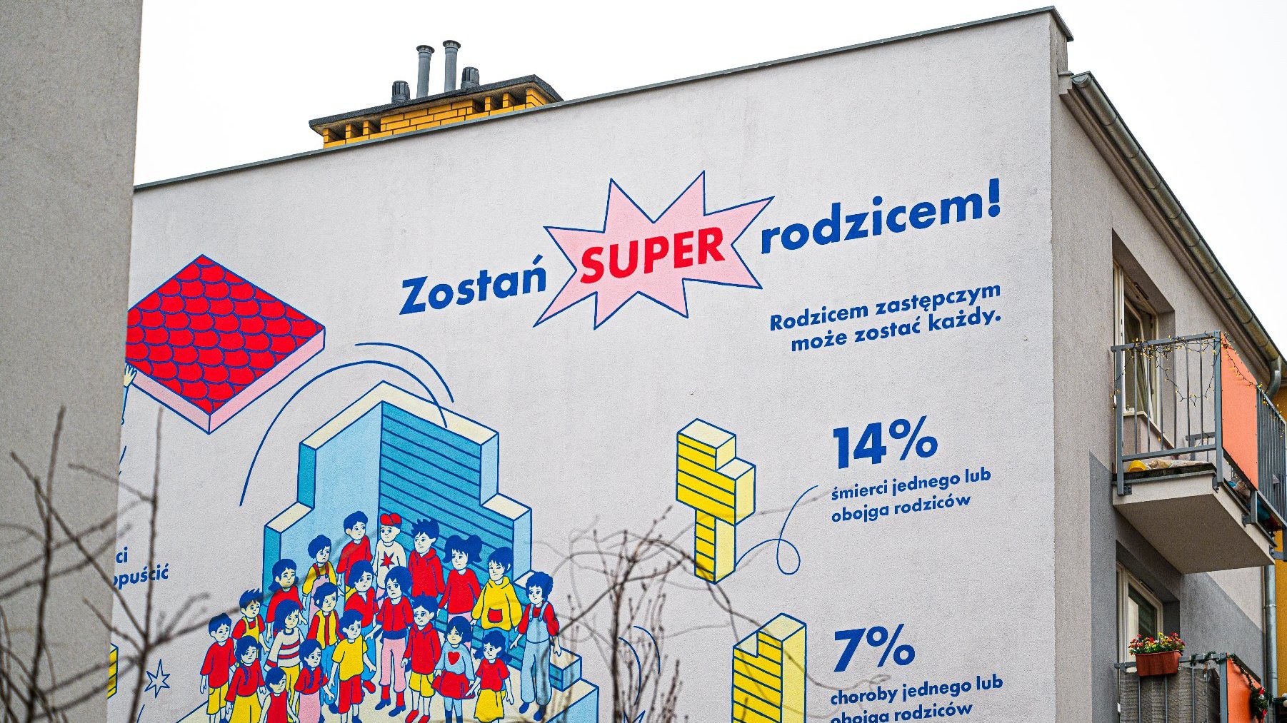 Na zdjęciu mural, zbliżenie na napis: Zostań super rodzicem